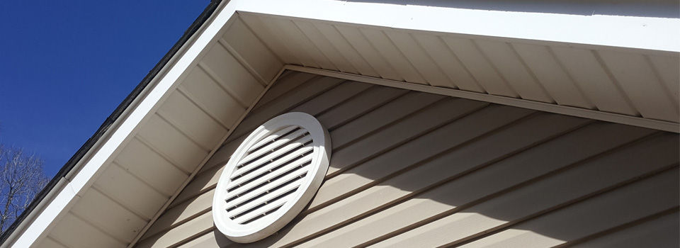 attic ventilator fan on peaked roof