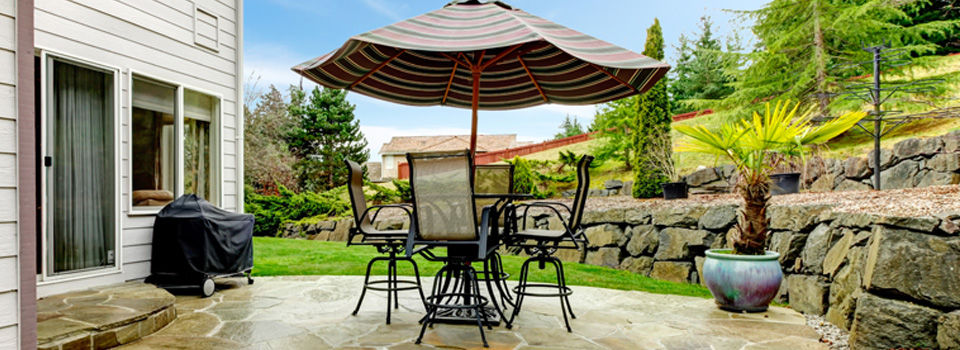 Flagstone patio and terrace landscaping with minimal grass lawn