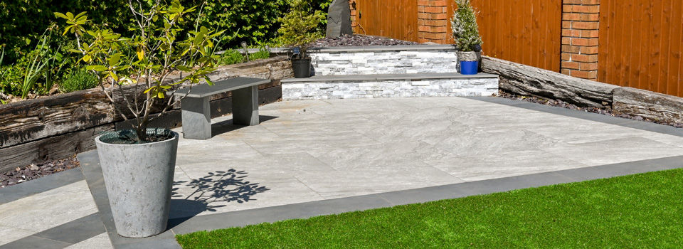 White porcelain paving and small grass play area