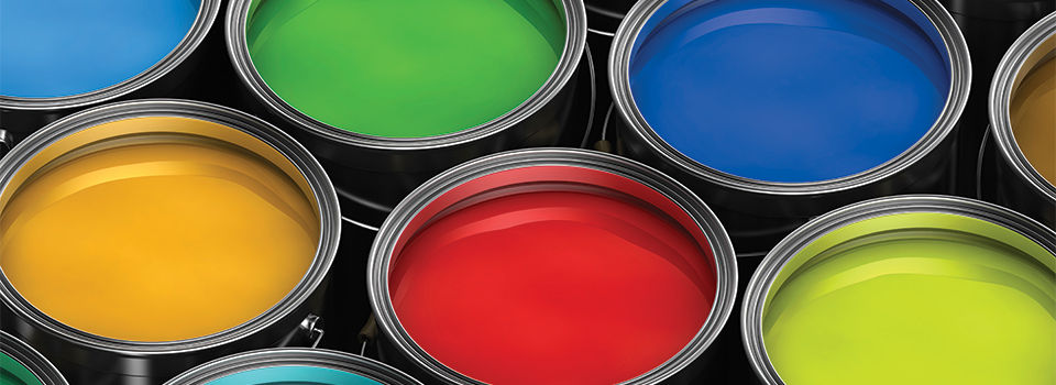 A close up image of nine colorful paint cans top view