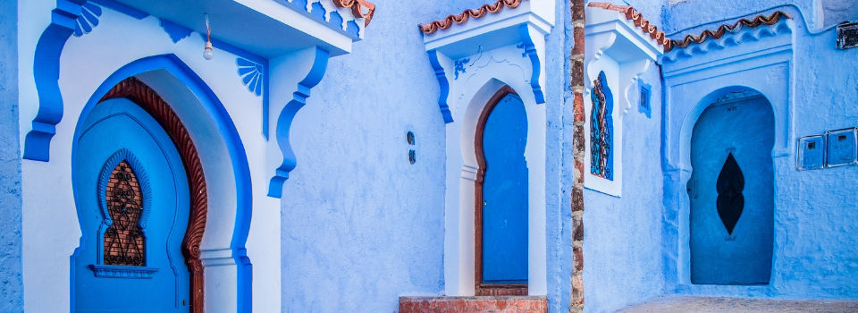 Bright blue exterior of buildings in city