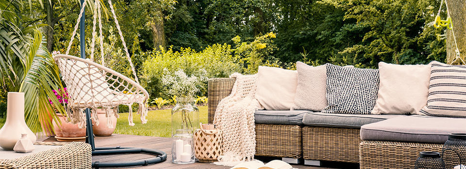 A backyard patio with cozy furniture