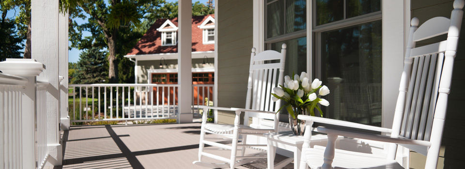 stained porch with chairs