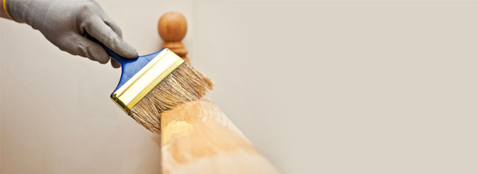 Person staining banister from a different angle 3