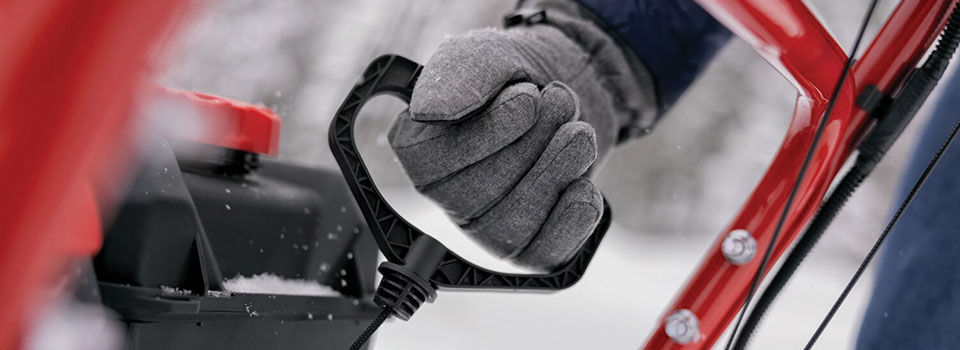 Person starting a snow blower
