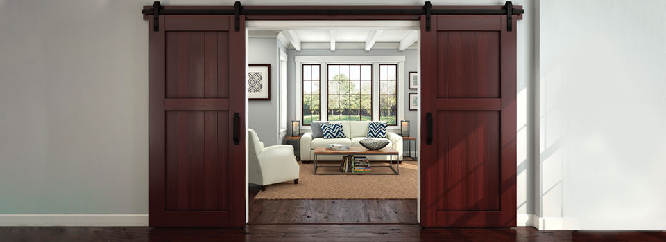 Brown wooden sliding barn doors in a traditional style of house