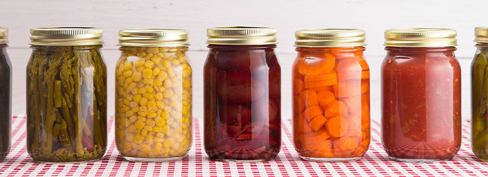 Jars lined up with preserved food