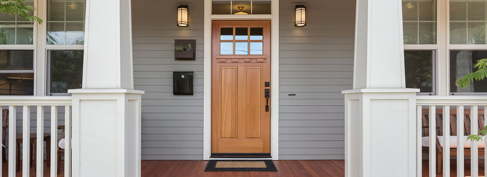 Front door of a well-kept, upscale home.