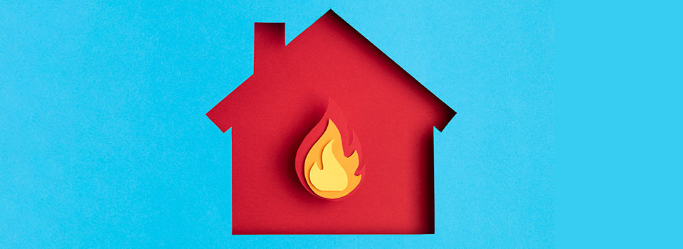 Illustration of a house with a flame in the middle