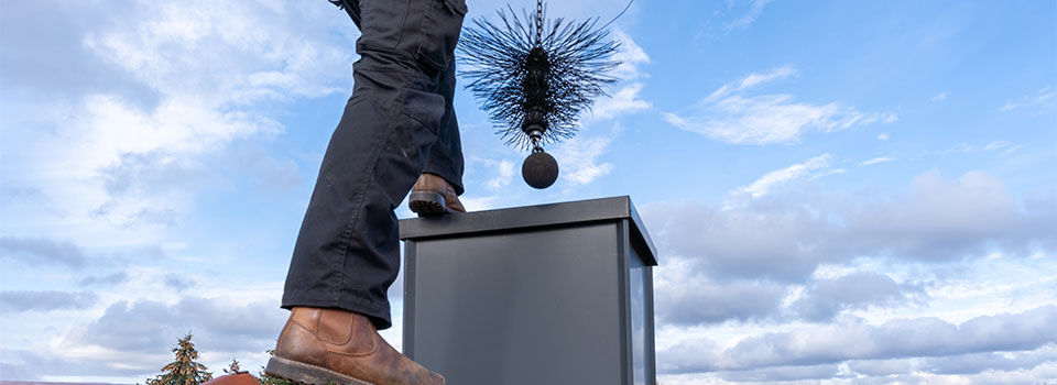 Man cleaning out a chimney