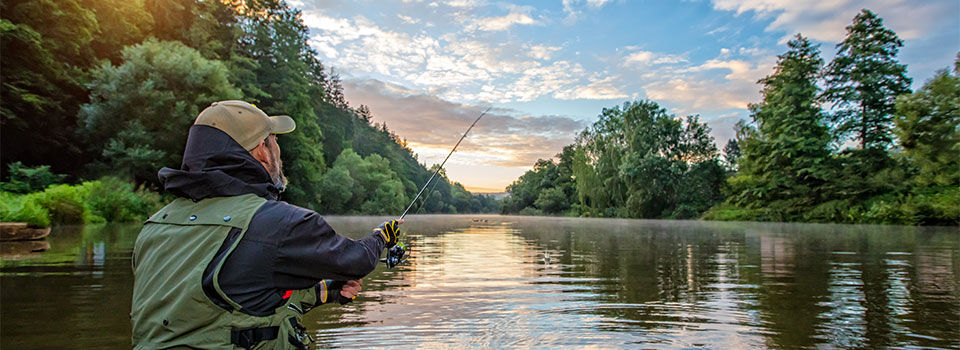 A man fishing in a river