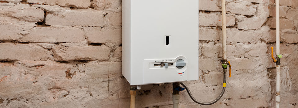 Tankless water heater on brick wall
