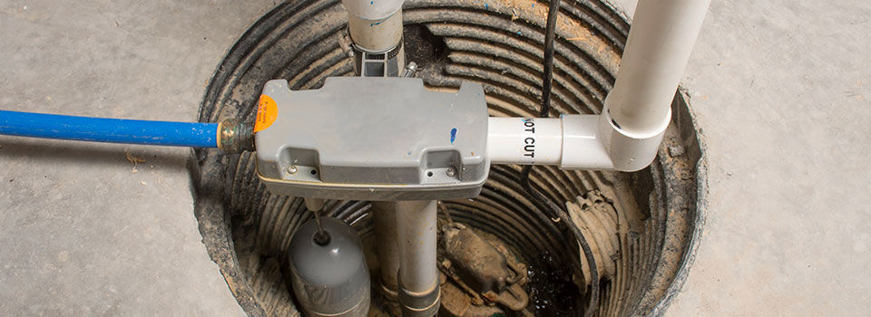 Overhead visual of a sump pump in a basement