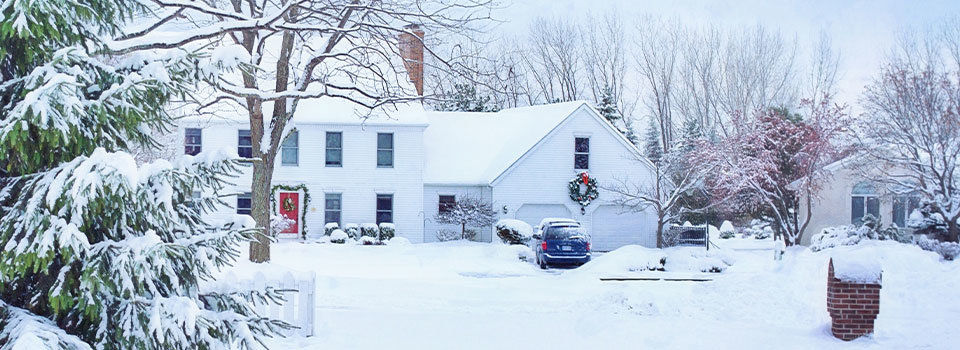 White house with snow on the ground