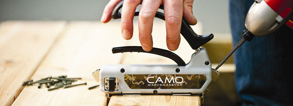 Close-up of a person using a CAMO Marksman Pro deck fastener