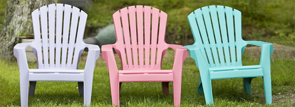 Three pastel colored plastic chairs