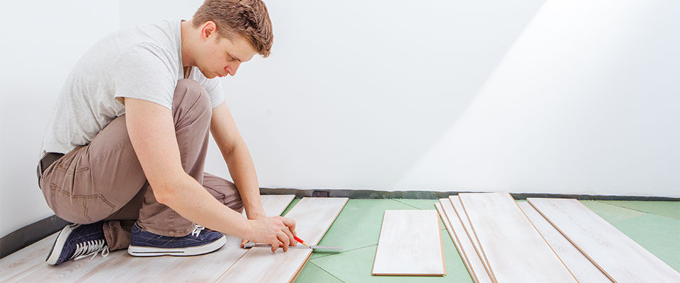Man installing vinyl plank flooring