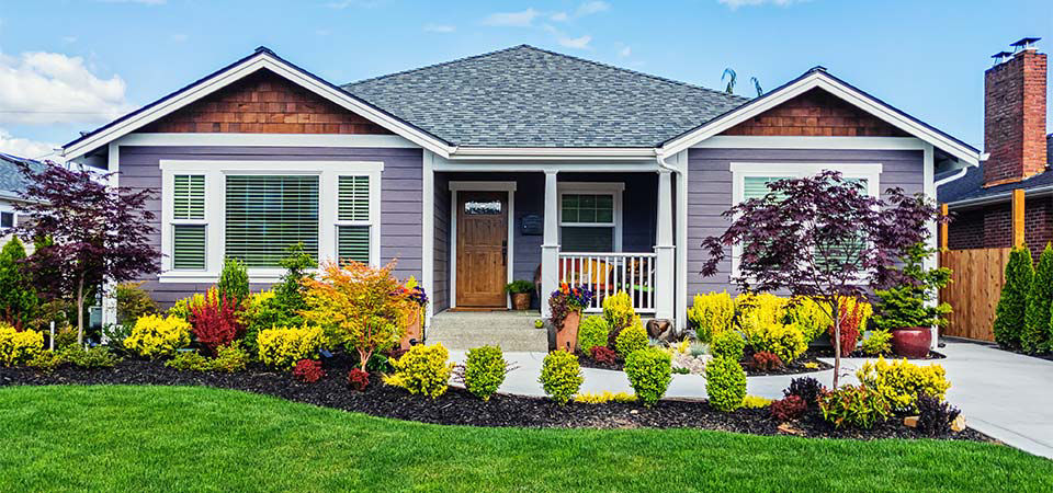 Beauty shot of house exterior featuring freshly manicured landscaping