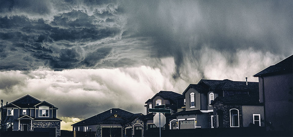 Dark stormy skies over a neighborhood