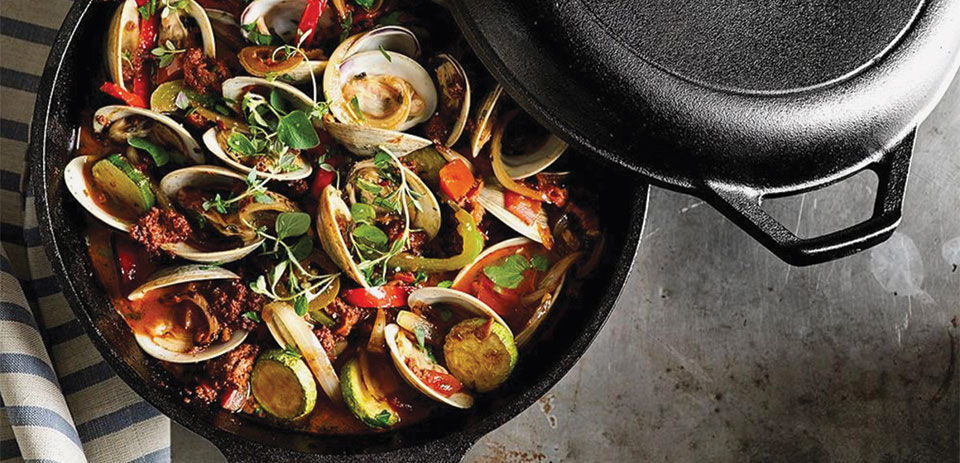 A clam dinner cooked in a skillet