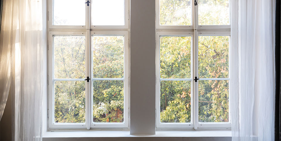 two closed white wooden windows