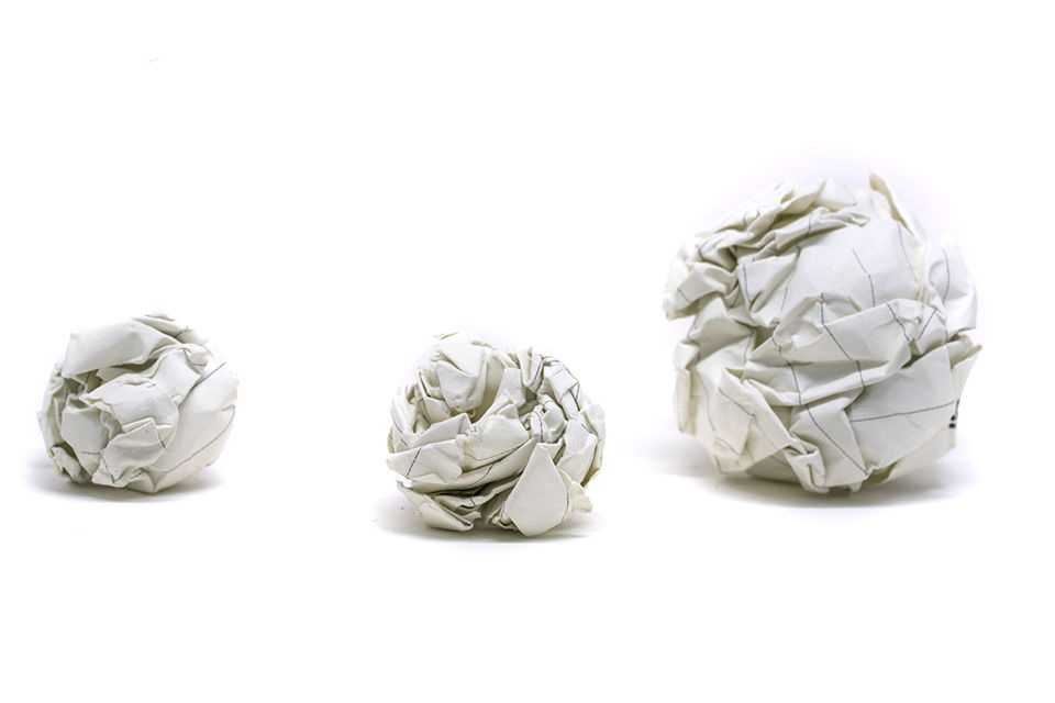 Three  crumpled up paper snow balls.