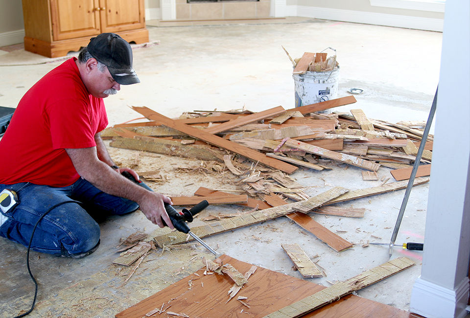 Man removing flooring