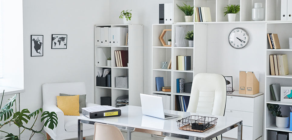 A home office featuring organizational cube shelves behind desk and chair