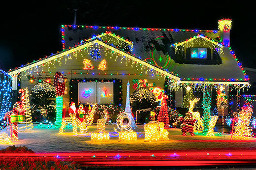 Christmas Lights hanging on snowy house