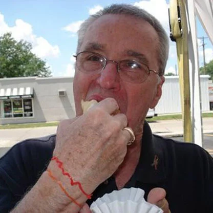 Ed Eating on Customer Appreciation Day. Ed, ~circa 2011