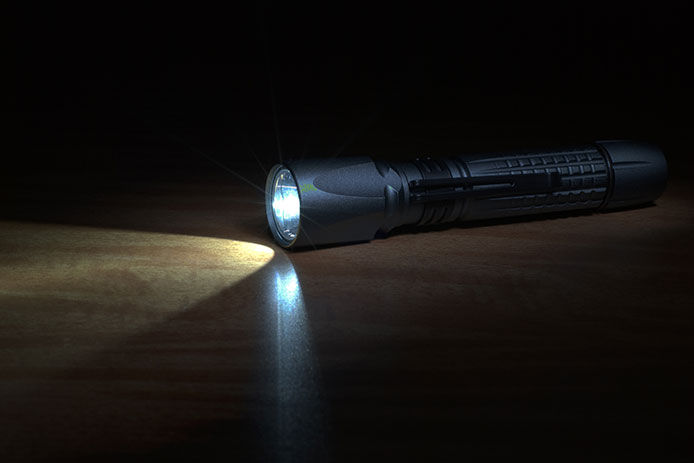 A turned on flashlight