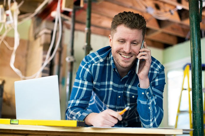 Man calling a potential general contractor