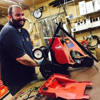 Derek working on a Snowthrower