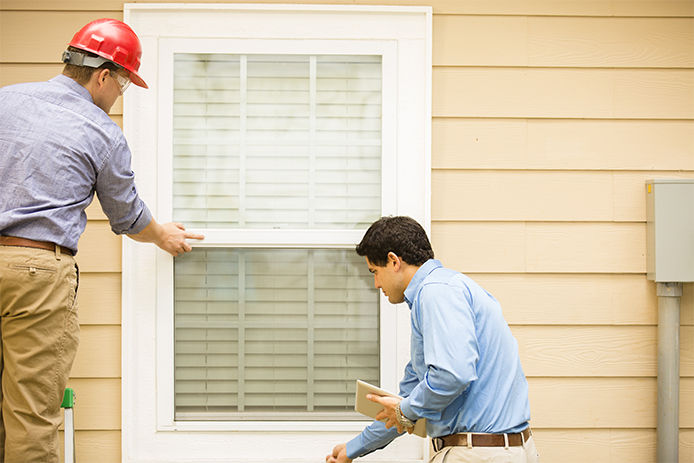 Men checking window