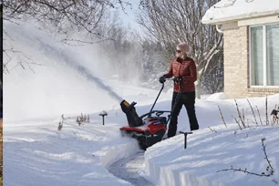 Person Snow Blowing Path From Their Front Door.