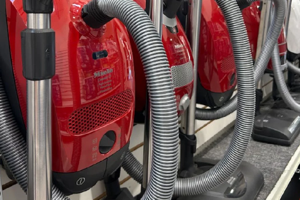 Miele vacuums on display advertising repair services